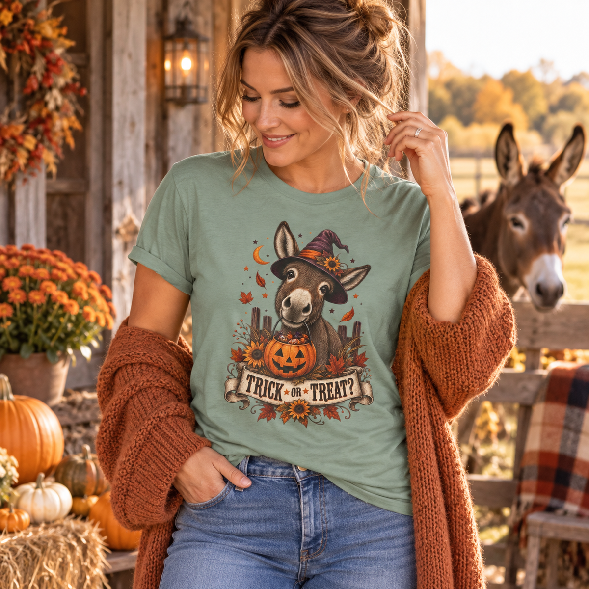 Woman wearing the Trick or Treat donkey Halloween tee in a fall farm setting